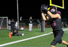 Tualatin rolls into state semifinals after another playoff blowout Tualatin receiver AJ Noland hauls in the first of two touchdown catches in a 47-14 win in the second round of the playoffs.