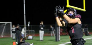 Tualatin rolls into state semifinals after another playoff blowout Tualatin receiver AJ Noland hauls in the first of two touchdown catches in a 47-14 win in the second round of the playoffs.