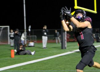 Tualatin rolls into state semifinals after another playoff blowout Tualatin receiver AJ Noland hauls in the first of two touchdown catches in a 47-14 win in the second round of the playoffs.