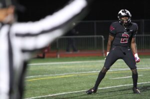 Tualatin's Thomas Ngure celebrates after making a stop on special teams.