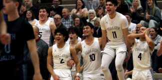 Tualatin boys advance to Chiles Center after dominant playoff win The Tualatin boys basketball team celebrates late their dominating second-round playoff win Saturday night.