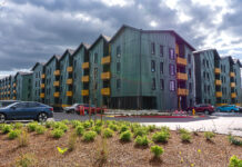 Excited residents move in while Plambeck Gardens’ grand opening ceremony is underway