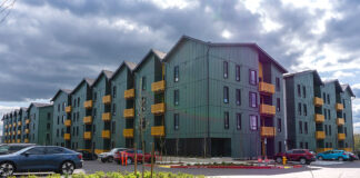 Excited residents move in while Plambeck Gardens’ grand opening ceremony is underway