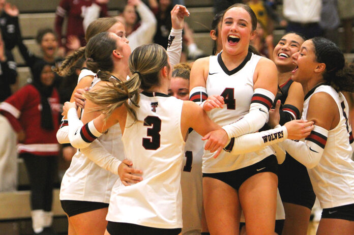 Georgia-Biedritzky-(No-4)-and-the-Timberwolves-celebrate-winning-a-point-against-Tigard