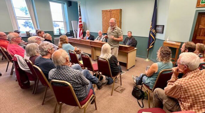 Gov. Kotek signals she’ll veto bill changing Oregon public meetings law criticized by journalists Roger Averbeck addresses his neighbors at a meeting of the Wallowa County Commission on Aug. 23, 2023. A new law meant to clarify what Oregon's public officials can discuss in serial communications to one another, such as calls and texts, is concerning to journalists and ethics watchdogs who say it erodes public meetings laws and allows important decisions to be made in private. (Photo by Matt Vasilogambros/Stateline)