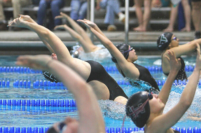 The-Tualatin-girls-ready-for-a-backstroke-race-against-Tigard.