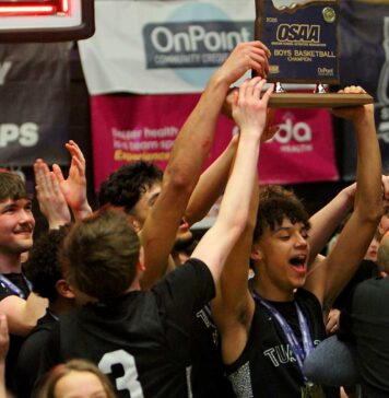 Tualatin boys cap improbable comeback to win state title The Tualatin boys basketball team celebrates after winning the state title thanks to a crazy finish that saw the Timberwolves hit two threes in the last nine seconds.
