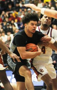 Tualatin's Takeo McCrae drives to rim in the state title game.