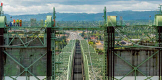 WA and Oregon scale back I-5 bridge ambitions as cost balloons to $14.4B Crews work on the Interstate 5 bridge over the Columbia River in 2019. (Oregon Department of Transportation)