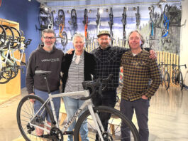 New Tualatin Bike/Coffee Shop combines riding and roasting Business partners Joe Holcomb and Stacey Daley stand alongside Service Manager Kurt Eisley and business partner Ken McClenahan.