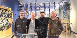 New Tualatin Bike/Coffee Shop combines riding and roasting Business partners Joe Holcomb and Stacey Daley stand alongside Service Manager Kurt Eisley and business partner Ken McClenahan.