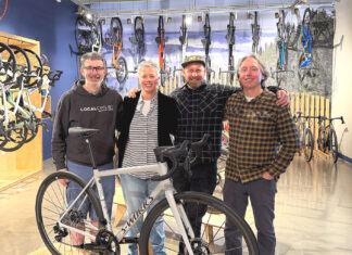 New Tualatin Bike/Coffee Shop combines riding and roasting Business partners Joe Holcomb and Stacey Daley stand alongside Service Manager Kurt Eisley and business partner Ken McClenahan.