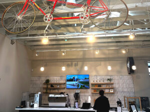 A barista at Local Cyclist makes coffee for customers on March 10, 2026.