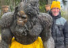 Extensive Circus Training A man with a Bigfoot statue.
