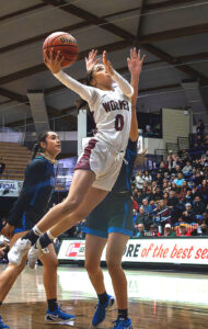 Tualatin's Bella Amens goes in for a lay-up against South Medford in the state semifinals.