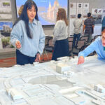 UO architecture students reimagine downtown Tualatin Laura Lopez (left) and Alex Schulte, third-year students in a University of Oregon architectural program, finetune placement of building replicas on a relief map of Tualatin’s downtown. They were participating in a March 10 symposium to exhibit their thoughts on the district’s rejuvenation.