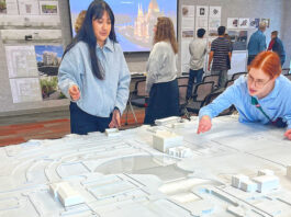 UO architecture students reimagine downtown Tualatin Laura Lopez (left) and Alex Schulte, third-year students in a University of Oregon architectural program, finetune placement of building replicas on a relief map of Tualatin’s downtown. They were participating in a March 10 symposium to exhibit their thoughts on the district’s rejuvenation.