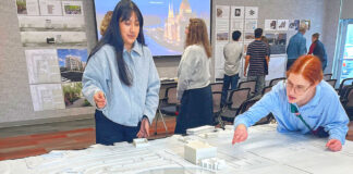 UO architecture students reimagine downtown Tualatin Laura Lopez (left) and Alex Schulte, third-year students in a University of Oregon architectural program, finetune placement of building replicas on a relief map of Tualatin’s downtown. They were participating in a March 10 symposium to exhibit their thoughts on the district’s rejuvenation.