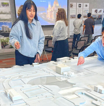 UO architecture students reimagine downtown Tualatin Laura Lopez (left) and Alex Schulte, third-year students in a University of Oregon architectural program, finetune placement of building replicas on a relief map of Tualatin’s downtown. They were participating in a March 10 symposium to exhibit their thoughts on the district’s rejuvenation.