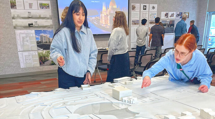 UO architecture students reimagine downtown Tualatin Laura Lopez (left) and Alex Schulte, third-year students in a University of Oregon architectural program, finetune placement of building replicas on a relief map of Tualatin’s downtown. They were participating in a March 10 symposium to exhibit their thoughts on the district’s rejuvenation.