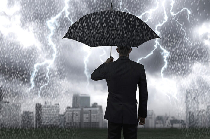 A man with an umbrella in a storm