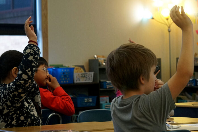 A second grader at Brooklyn Primary School in Baker City raises his hand during a phonics lesson. Elementary school students in Baker City will get 147 days in school this year, according to data from ECOnorthwest, about 33 days less than kids in most other states, where laws mandate a 180-day school year.