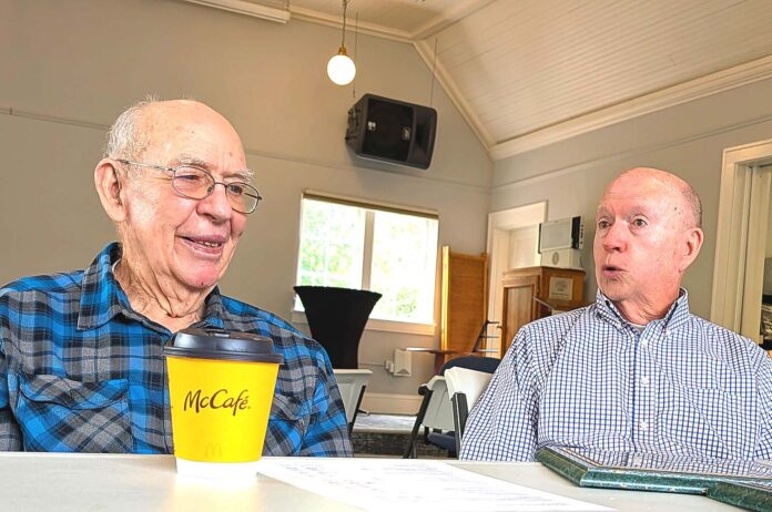 Norm Parker (left) and Larry McClure discuss the history of the Tualatin Heritage building, which used to be a Methodist Church, with Tualatin Life.