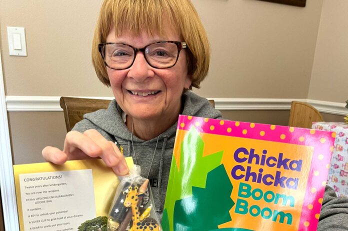 Retired-Kindergarten-teacher-Diane-Bonica-WEB Diane Bonica, who retired from teaching kindergarten in 2014, shows elements of packages she is giving to that year’s class of students as they now graduate from high school. It is her last of 28 years of fulfilling her annual gift tradition.
