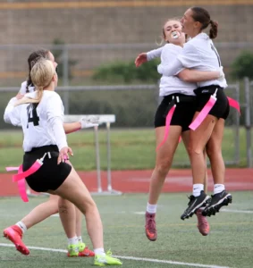 The Timberwolves celebrate a walk-off win the state title game, where sophomore Sydney Murdick caught a touchdown pass in overtime for the win. 