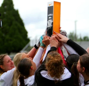 The Tualatin flag football team celebrates after winning the state title on Saturday, the school's first championship in the sport, which started at the school last year. 
