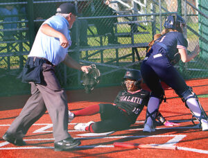 Tualatin's Paige Estes races around the corner trying to out-run a defender.