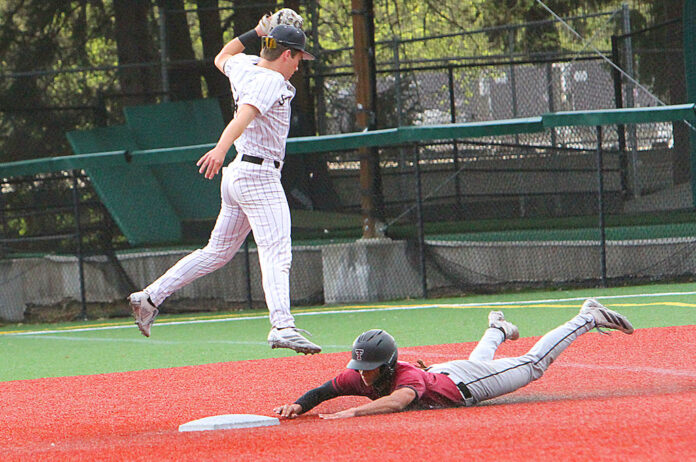 Tualatin's Hayden Camacho slides into second for a stolen base.