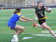 Flag football continues to grow at Tualatin and around the state Tualatin's Paige Estes races around the corner trying to out-run a defender.
