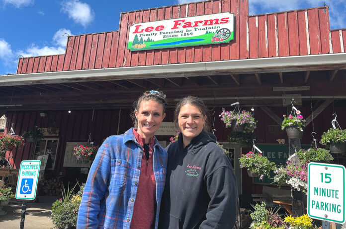 teagan-and-annie Lee Farm Teagan Lee Milera and Annie Lee standing in front of Lee Farms on April 16, 2026.