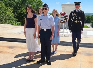 Teen from Tualatin Lays Wreath on Tomb of the Unknown Soldier Bo Pfeifer (center) presents a wreath to the Tomb of the Unknown Soldier at Arlington National Cemetery.