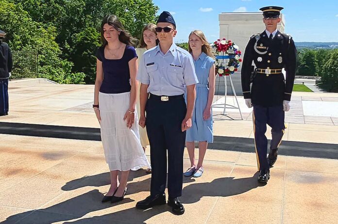 Bo Pfeifer (center) presents a wreath to the Tomb of the Unknown Soldier at Arlington National Cemetery.