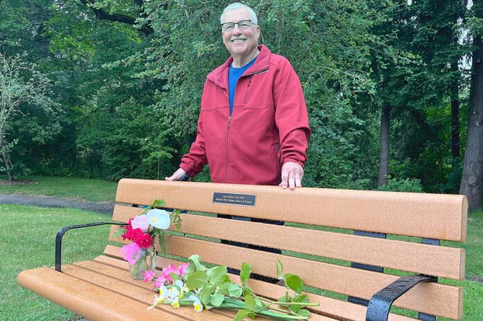 Steve Stolze drove up from Redmond, Ore. to attend the unveiling of his late wife’s memorial park bench in Ibach Park on May 29, 2026.