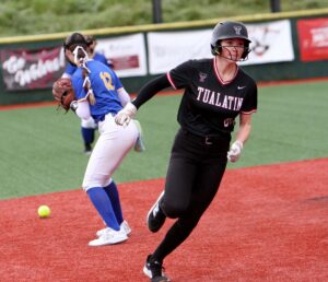 Tualatin's Reese Strode rounds second on an RBI triple in the Timberwolves first-round playoff win against Aloha.