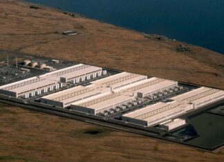 Data centers are driving demand for gas from Northwest utilities, reports find An explosion of data center facilities, including the one pictured here in Umatilla County on May 18, 2026, have been built in Oregon along the Columbia River Gorge during the last few years. The boom has caused a more than 500% load growth for the Umatilla Electric Cooperative during the last decade, which has had to buy more gas and coal-powered electricity on the wholesale market to meet demand.