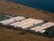 Data centers are driving demand for gas from Northwest utilities, reports find An explosion of data center facilities, including the one pictured here in Umatilla County on May 18, 2026, have been built in Oregon along the Columbia River Gorge during the last few years. The boom has caused a more than 500% load growth for the Umatilla Electric Cooperative during the last decade, which has had to buy more gas and coal-powered electricity on the wholesale market to meet demand.