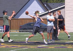 Horizon Christian's Hunter Woody tosses a pass during a summer workout before the school's first full football season since 2018.