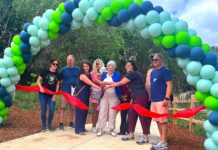 Ribbon Cutting Ceremony at Tualatin’s New Nyberg Creek Trail Tualatin City Councilor Valerie Pratt, surrounded by other key project planners like Tualatin East CIO President Doug Ulmer, cuts the ribbon at the Nyberg Creek Trail grand opening on Saturday, June 20.