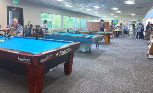 Juanita Pohl Center members played pool under new LED ceiling lights on June 12, 2026.