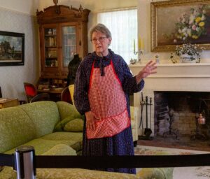 Tualatin Historical Society volunteer Sandra Lafky Carlson told attendees on July 12 that the Sweek House living room was originally two parlors that were remodeled into one in the 1920s.