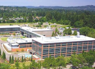 Tualatin Economy: “Doing Great” According to Industry Analysis An aerial view shows the Lam Research complex in Tualatin. High-tech manufacturing remains a primary economic driver for the city, accounting for nearly 5,000 local jobs and leading projected growth over the next decade.
