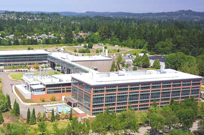 An aerial view shows the Lam Research complex in Tualatin. High-tech manufacturing remains a primary economic driver for the city, accounting for nearly 5,000 local jobs and leading projected growth over the next decade.