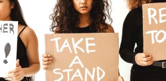 Why not be an Advocate for your own city? Women holding Take A Stand Signs