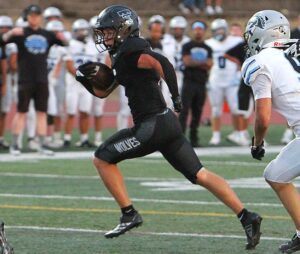 Tualatin Cole Hachmeister cuts to the outside for a rushing touchdown in Tualatin.