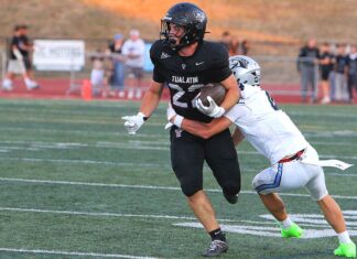 Tualatin football looks to bounce back after early playoff exit Tualatin junior Iden Rule helepd the Timberwolves offense get going after a slow start en route to a 52-13 win to kick off the season.