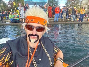 Alia Martin, wearing a Guy Fieri costume, during the 2025 regatta in Tualatin. For Martin, the race is the culmination of months of soil prep and vine tending, having successfully grown giant pumpkins for both the 2025 and 2026 events.